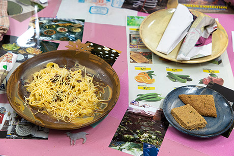 duck basturma carbonara by Amna, rosemary cookies, laid out on the tables pink section. 