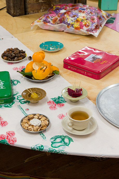 detail of foods on table, candied chestnut, pickled beets, hops tea, shelfs of hazelnuts, peels of tangerines, pistachio shells